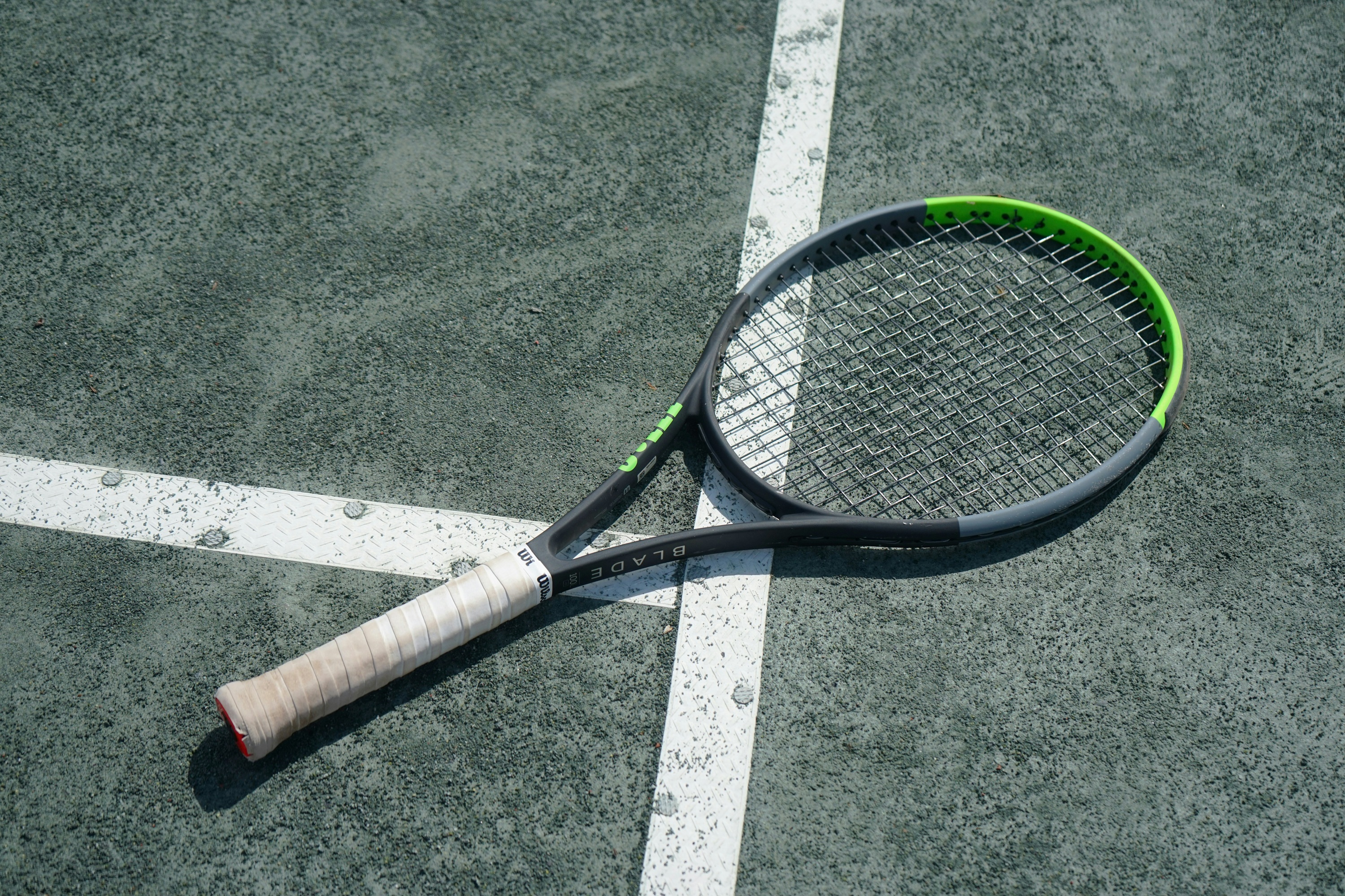 Tennis racket on a tennis court